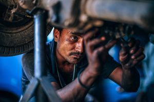 Mechanic fixing a car
