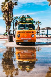 Image of a van with surfboards on top