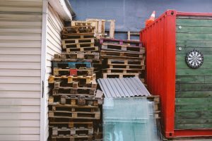 A pile of stuff next to a storage unit - what is the storage unit cost in Florida?