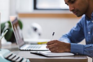 Man making a financial plan - something you should do when looking for the States with the cheapest homes.