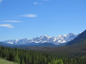 The slopes of the Rocky Mountains seen from a distance.