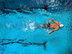 A person swimming in a pool.