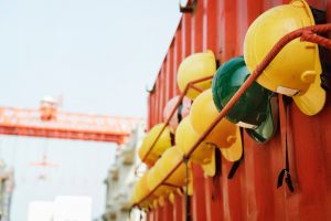 Helmets placed along the side of a shipping container