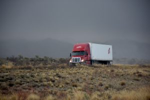 Truck on a foggy road - sometimes transit insurance for moving interstate is a must.