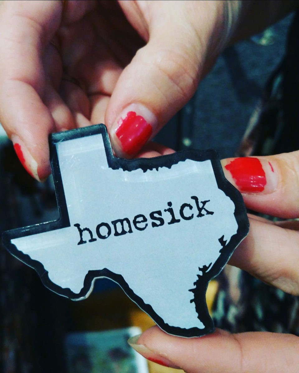 A magnet with Homesick on it.