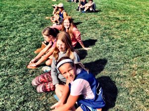 kids sitting on grass