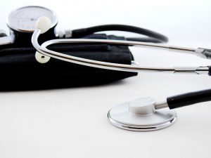 A stethoscope on a white surface.
