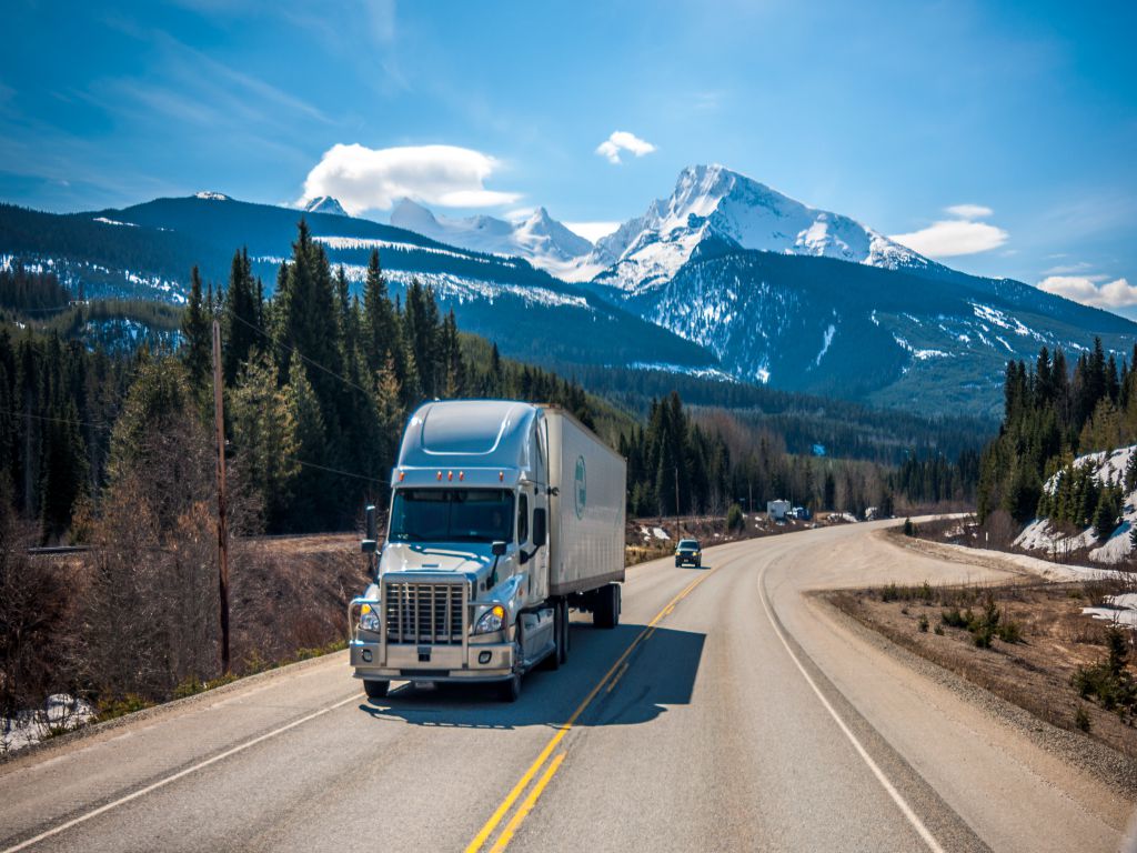 A moving truck going down a road, representing the most interesting moving industry statistics.