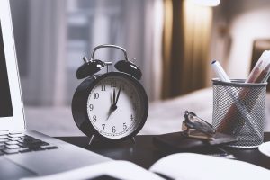 An alarm clock on a desk.