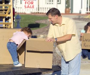 man and a child with a moving box