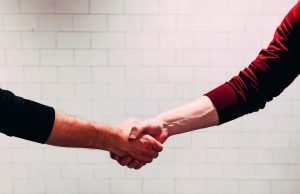 Two people shaking hands.