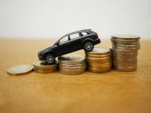 Toy car on top of the coins