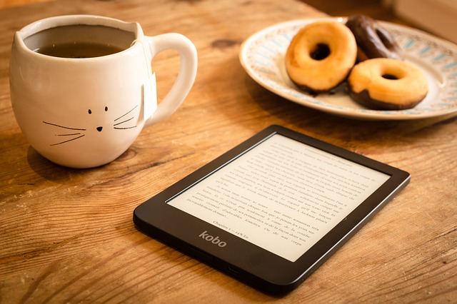 Tablet, coffe mug, donuts