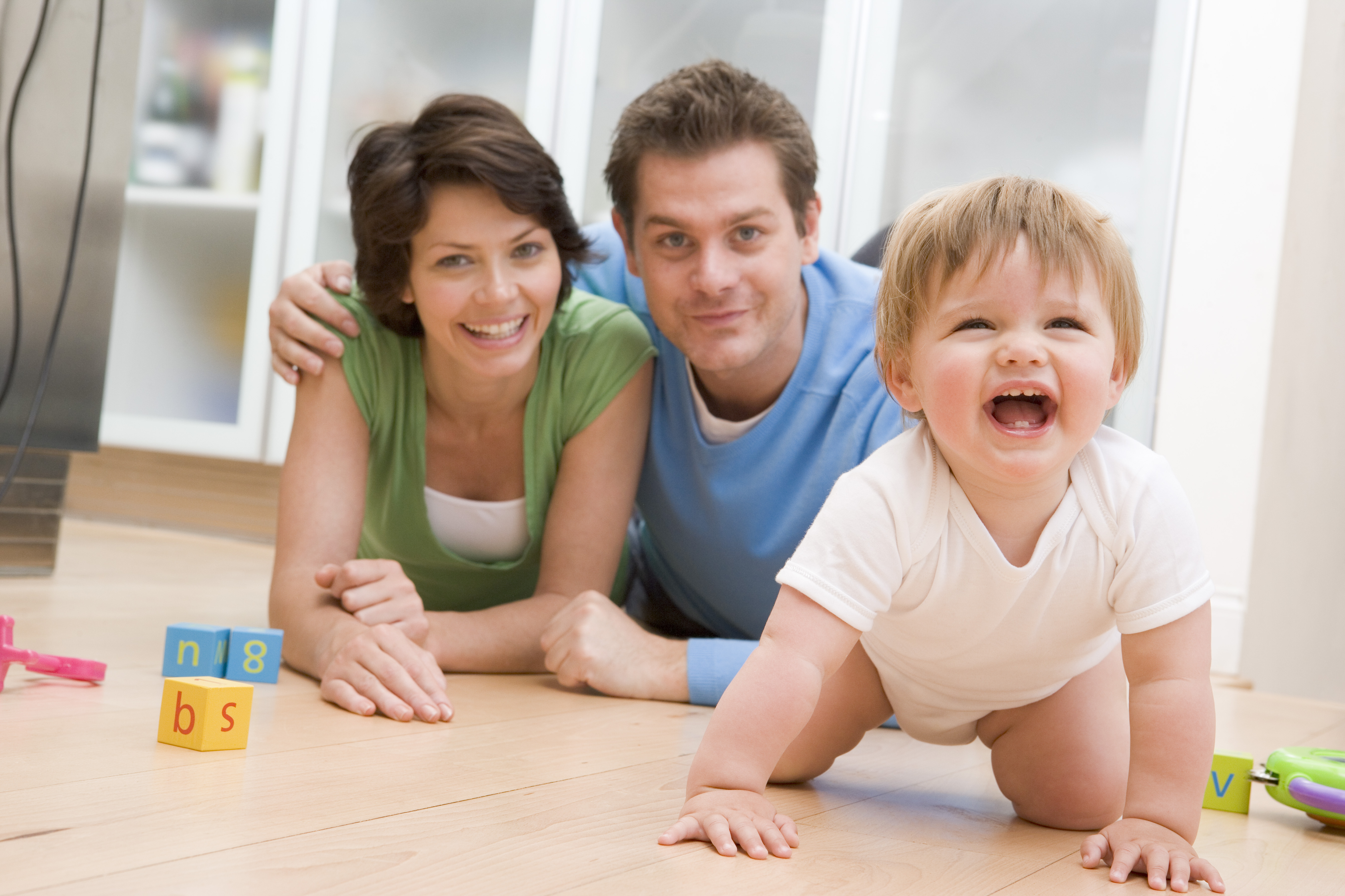 Crawling baby with parents - long distance moving companies Gillette 