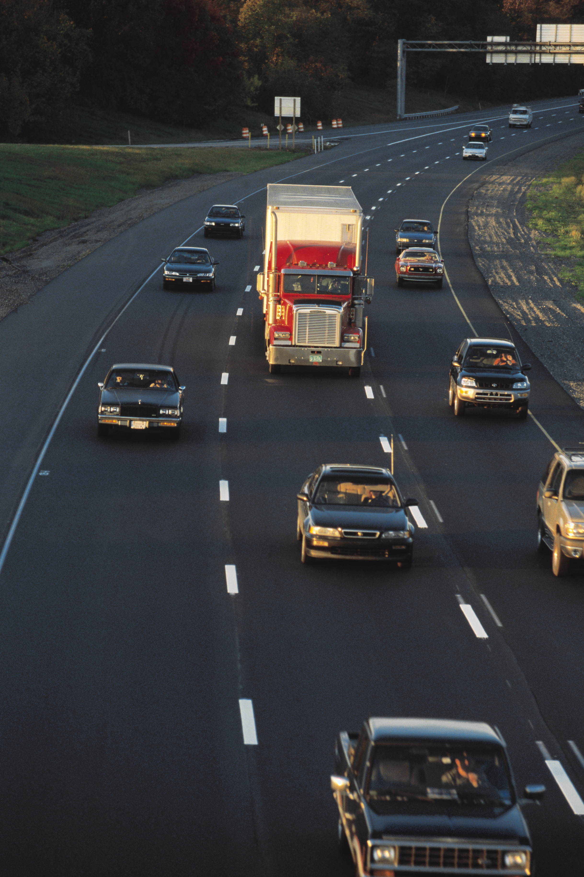 Semi truck on highway with cars