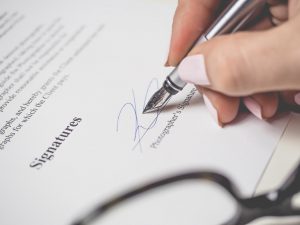 A person signing a contract