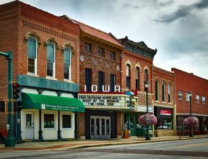 Photo of a movie theather with an Iowa sign on it