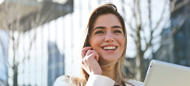 A girl on the phone smiling