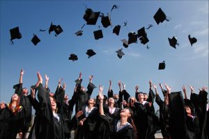 Newly Graduated People Wearing Black Academy Gowns