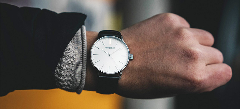 A man looking at his watch