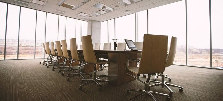 A conference room with a table and chairs