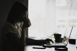 A woman conducting a moving companies research