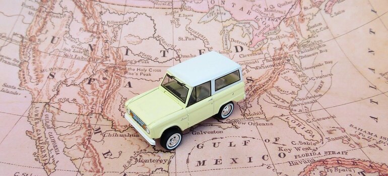 A model of a car on a map of the United States