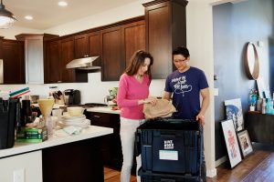 Man and woman packing for a move