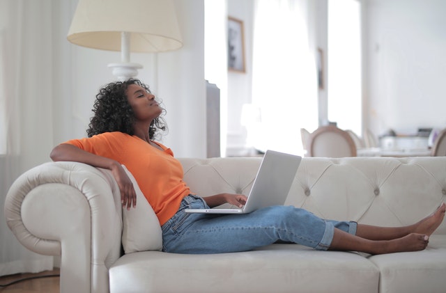 Woman relaxing after hiring one of the best cross country moving companies Toledo