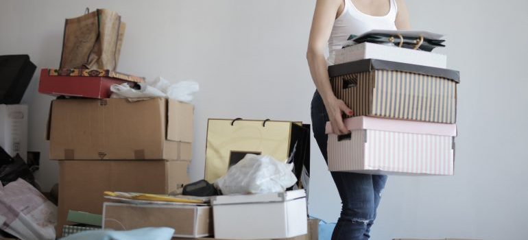 Woman carrying boxes