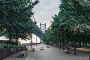 a park in Philadelphia under a bridge