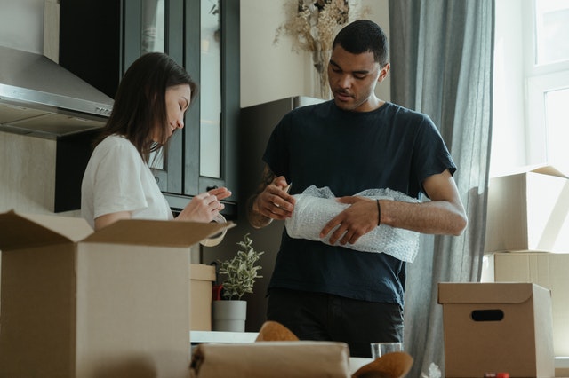 A man and a woman packing