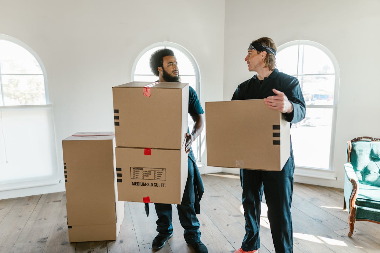 two men holding boxes