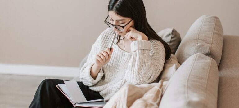 -woman sitting and writing