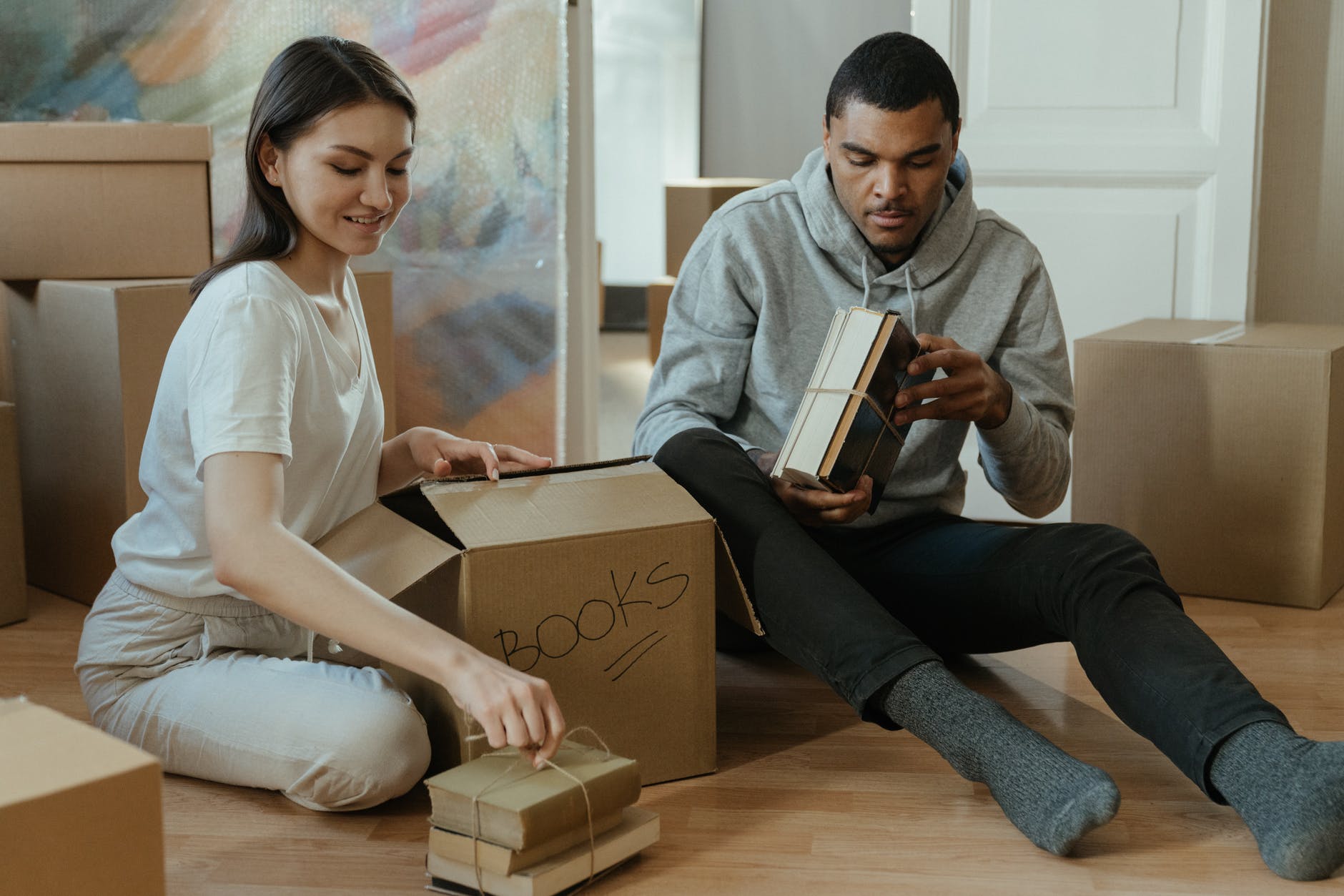 a couple packing their belongings