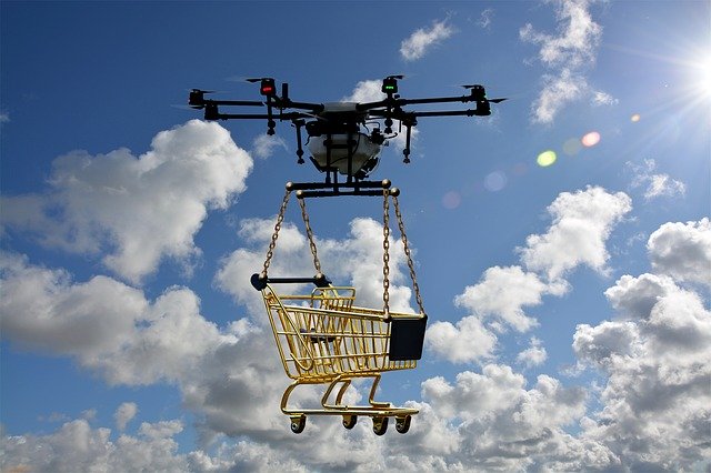 A drone carrying a shopping cart