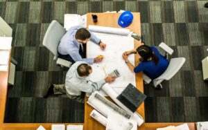 Three people having a meeting