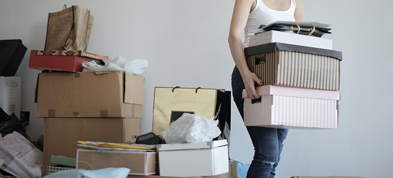 woman decluttering before moving from West Virginia to Georgia