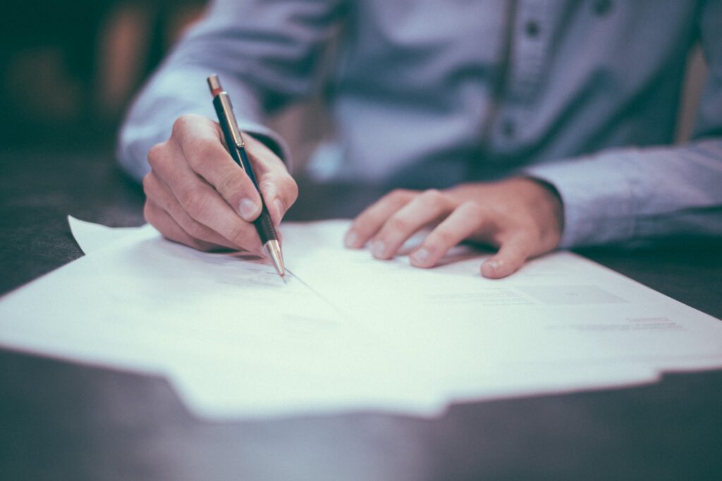 A man filling out some papers