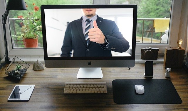 a man on the computer screen