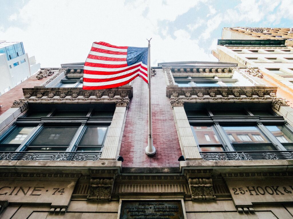 American flag haning from a building