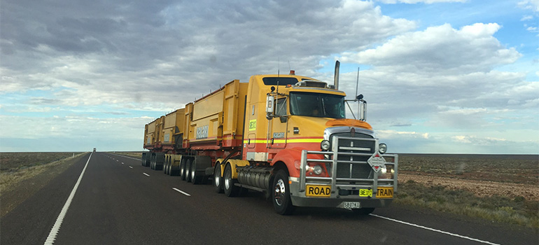 A yellow moving truck