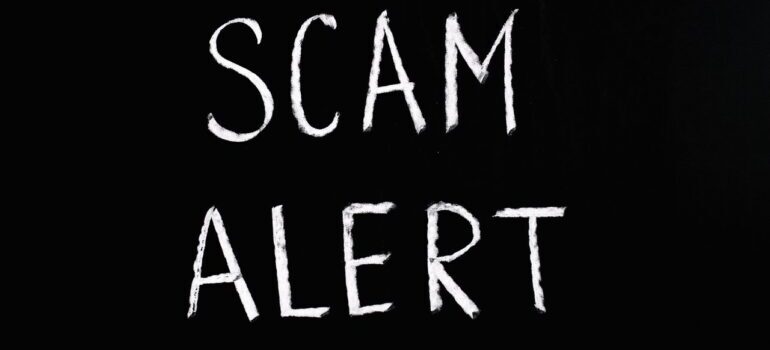 scam alert on black background