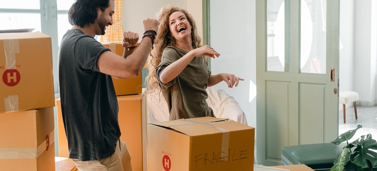 couple laughing and looking for long distance movers Paradise