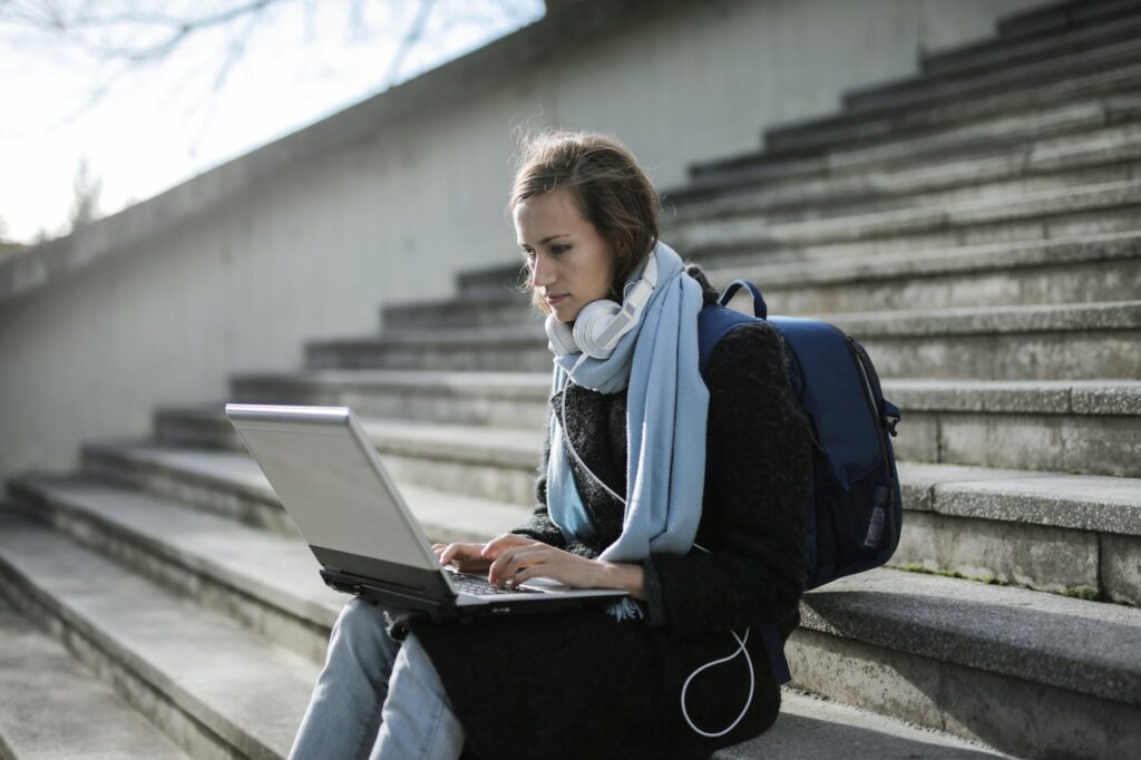 college student working on a laptop