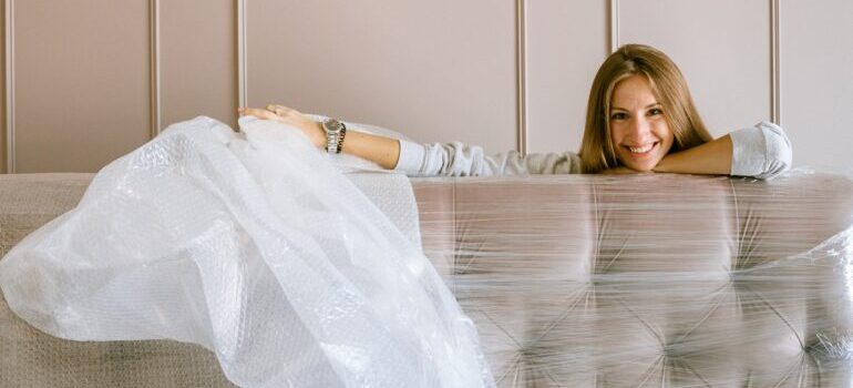 woman unpacking after Men on the Move relocated her belongings