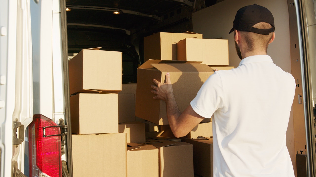 Man loading the moving van for moving from South Burlington to Boston