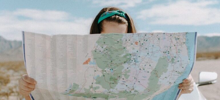 female person looking into the world map
