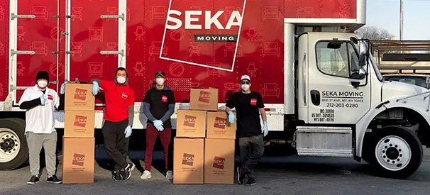 seka moving crew in front of the company's moving truck