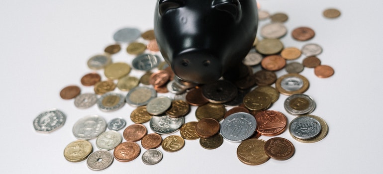 Black piggy bank and pennies